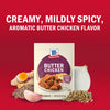 A package of McCormick Butter Chicken seasoning mix is displayed with fresh ingredients like turmeric garlic and onion highlighting the creamy mildly spicy and aromatic flavor of the product.