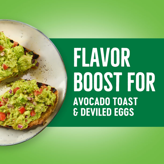 Avocado toast with red onion and tomato on a white plate with the text Flavor Boost for Avocado Toast &amp; Deviled Eggs on a green background.