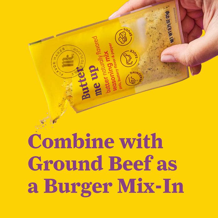 A hand pours the McCormick Butter Me Up burger mix-in into ground beef.
