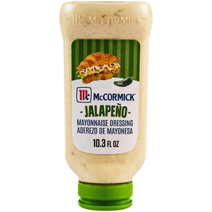 A squeeze bottle of McCormick Jalapeño Mayonnaise Dressing with a green cap and a label illustrating a croissant sandwich next to a green jalapeno pepper.