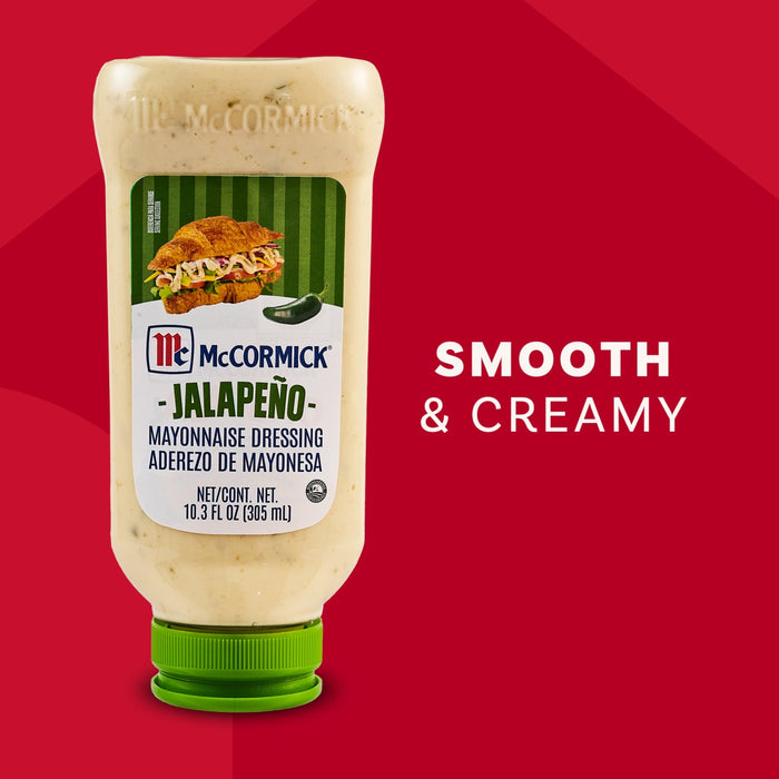 A squeeze bottle of McCormick Jalapeno Mayonnaise Dressing stands on its green cap against a red background next to the words Smooth and Creamy.