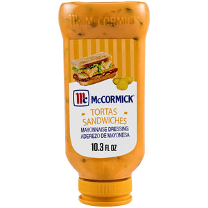 A squeeze bottle of McCormick Tortas Sandwiches Mayonnaise Dressing showing a sandwich and pickles on the label.