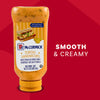 A squeeze bottle of McCormick Tortas Sandwiches Mayonnaise Dressing with sweet pickles is displayed against a red background next to the words SMOOTH and CREAMY.