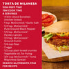 Two Torta de Milanesa sandwiches filled with breaded cutlets, avocado, and tomato sit on a wooden board below text describing them as a delicious Mexican street food inspired sandwich and directing users to search McCormick.com for the recipe.