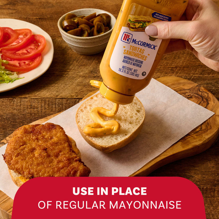 A hand squeezes McCormick Tortas Sandwiches Mayonnaise Dressing onto a sandwich bun above a breaded cutlet to demonstrate its use in place of regular mayonnaise.