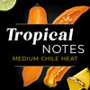 A habanero pepper with a lime and pineapple slice with the text Tropical Notes Medium Chile Heat on a black background.