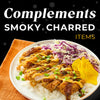 A plate of food with breaded chicken rice cabbage and pickled ginger.