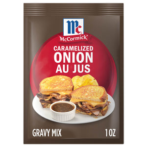 A packet of McCormick Caramelized Onion Au Jus gravy mix is displayed, featuring a sandwich with melted cheese and a side of gravy.