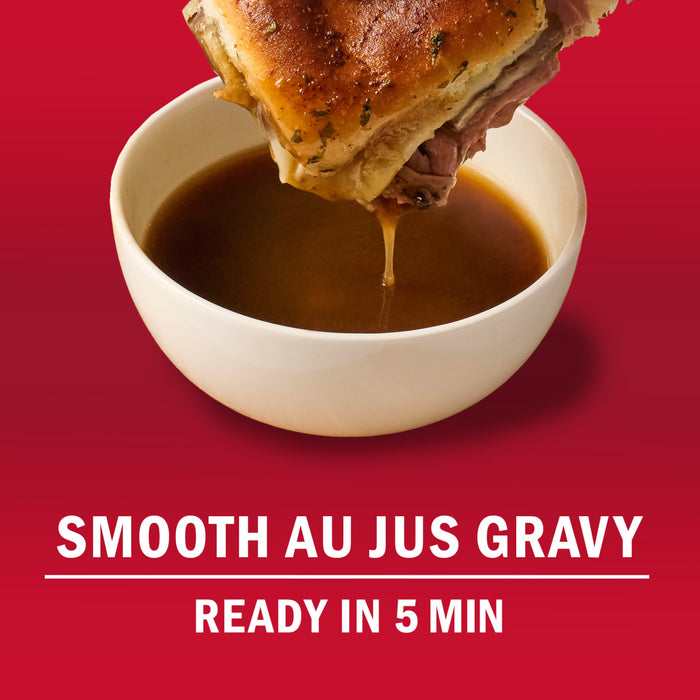 A sandwich is being dipped into a bowl of smooth au jus gravy, ready in 5 minutes.