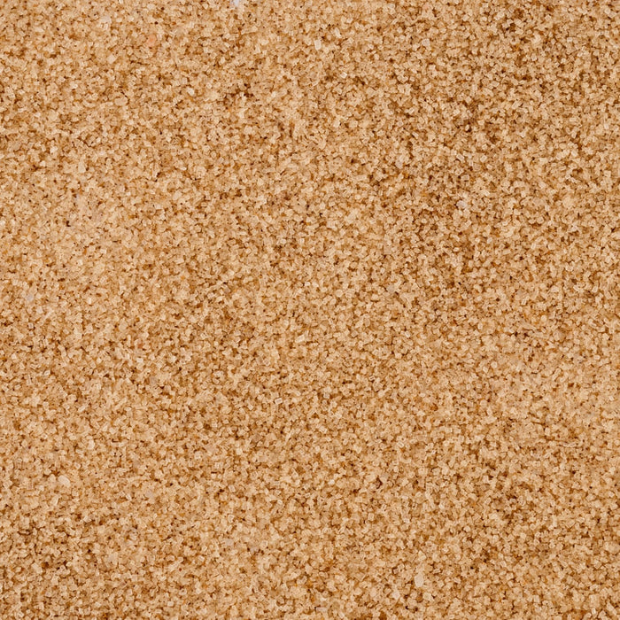 A close-up, overhead shot highlights the light brown, crystalline texture of Mccormick Harry Potter Chocolate Frog Finishing Sugar, 3.47 Oz.