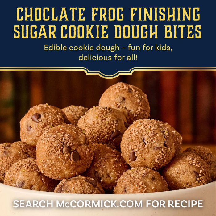Edible chocolate chip cookie dough bites are piled in a bowl and topped with a generous sprinkle of Mccormick Harry Potter Chocolate Frog Finishing Sugar, 3.47 Oz.