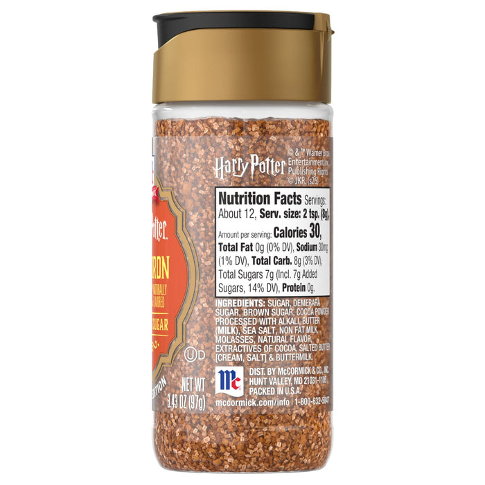 A clear jar of Mccormick Ravenclaw Finishing Sugar Harry Potter 3.37 Oz, filled with brown and gold sugar crystals, with the nutrition facts and ingredients visible on the label.