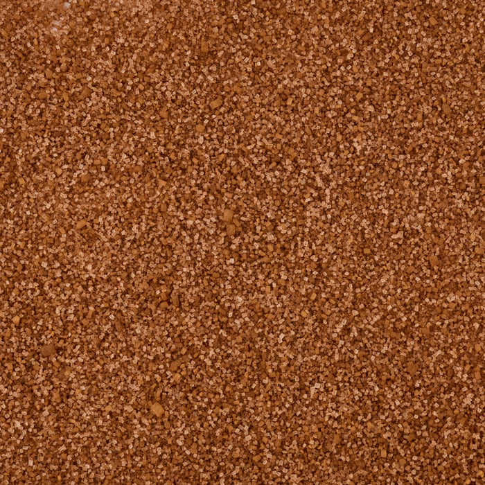 A detailed, top-down macro shot reveals the sparkling brown and white crystals of the Mccormick Harry Potter Cauldron Cake Finishing Sugar, 3.43 Oz.