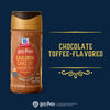 A bottle of the limited edition Mccormick Harry Potter Cauldron Cake Finishing Sugar, 3.43 Oz, is shown against a dark blue background, with text identifying the flavor as chocolate toffee-flavored.