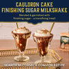 Two decadent Cauldron Cake Finishing Sugar Milkshakes are garnished with Mccormick Harry Potter Cauldron Cake Finishing Sugar, 3.43 Oz, and served on a gold tray.