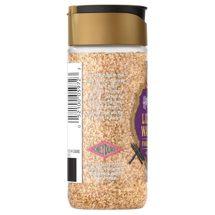 A clear bottle of Mccormick Slytherin Finishing Sugar Harry Potter 3.37 Oz, a black licorice-flavored finishing sugar, stands upright, featuring its label with product details and a barcode.