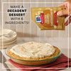 A hand sprinkles Mccormick Salted Caramel Cheesecake Seasoning Mix, 1.62 Oz over a decadent cheesecake with a graham cracker crust to show how to make a dessert with only six ingredients.