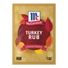 A single-use packet of Mccormick Turkey Rub, 1.25 Oz features a festive autumn design with colorful leaves and a gold bokeh background.