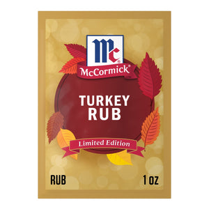A single-use packet of Mccormick Turkey Rub, 1.25 Oz features a festive autumn design with colorful leaves and a gold bokeh background.
