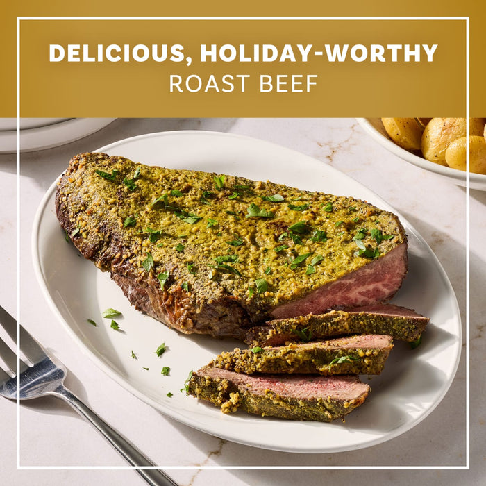 A platter of sliced roast beef seasoned with Mccormick Garlic And Herb Butter Roast Seasoning Mix, 1.0 Oz is presented as a delicious holiday-worthy meal.