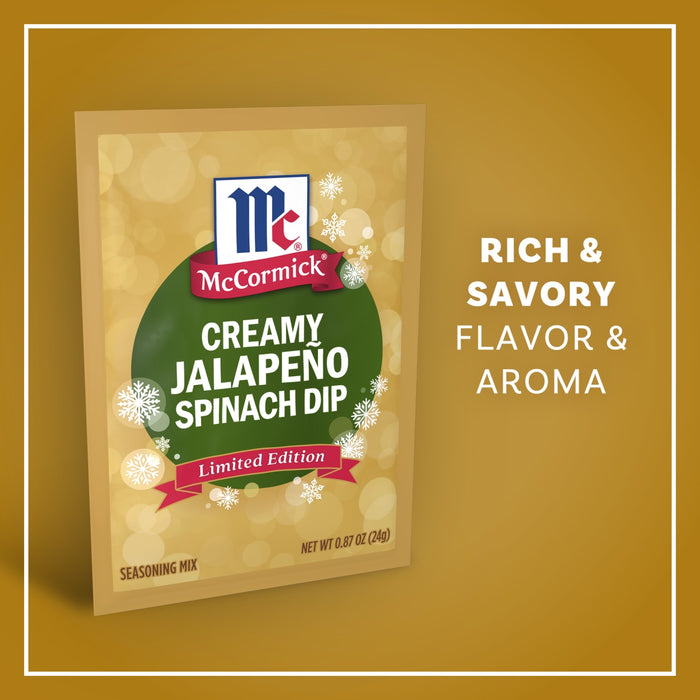 A package of Mccormick Creamy Jalapeno Spinach Dip Seasoning Mix, 0.87 Oz is displayed against a golden background with festive snowflakes and text highlighting its rich and savory flavor and aroma.