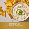 A bowl of creamy dip topped with fresh jalapeño slices and surrounded by tortilla chips showcases the versatility of Mccormick Creamy Jalapeno Spinach Dip Seasoning Mix 0.87 Oz for cold appetizers.