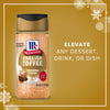 Three bottles of Mccormick English Toffee Finishing Sgr 3.7 Oz are showcased as Limited Edition Seasonal Flavors against a festive golden background with snowflakes.