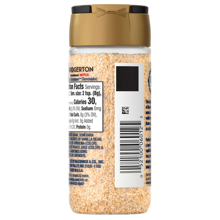 A container of McCormick Garlic Powder with a gold lid and a nutrition facts label.