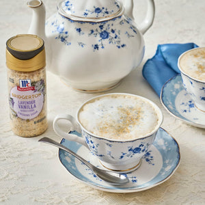 A cup of tea with McCormick Cinnamon Sweet Salt next to a teapot, suggesting a cozy and flavorful tea experience.