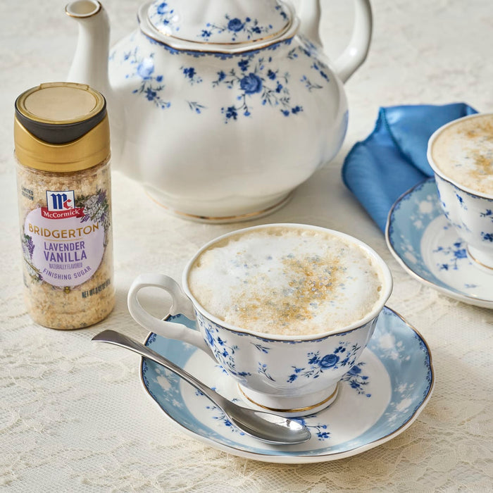 A cup of tea with McCormick Cinnamon Sweet Salt next to a teapot, suggesting a cozy and flavorful tea experience.