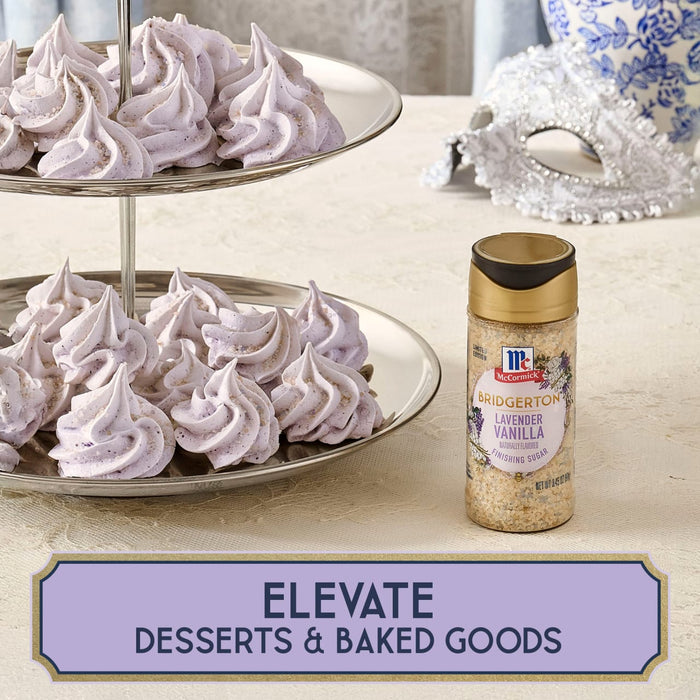 A two-tiered dessert stand displays lavender-colored meringue cookies next to a bottle of McCormick Lavender Sugar, highlighting the product's use in elevating desserts and baked goods.