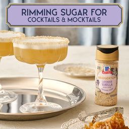 A cocktail glass rimmed with McCormick's Signature Salt La Margarita Blend is displayed on a silver tray, suggesting a festive drink.