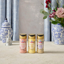 A trio of Morton Salt products are displayed against a backdrop of elegant blue and white decor.