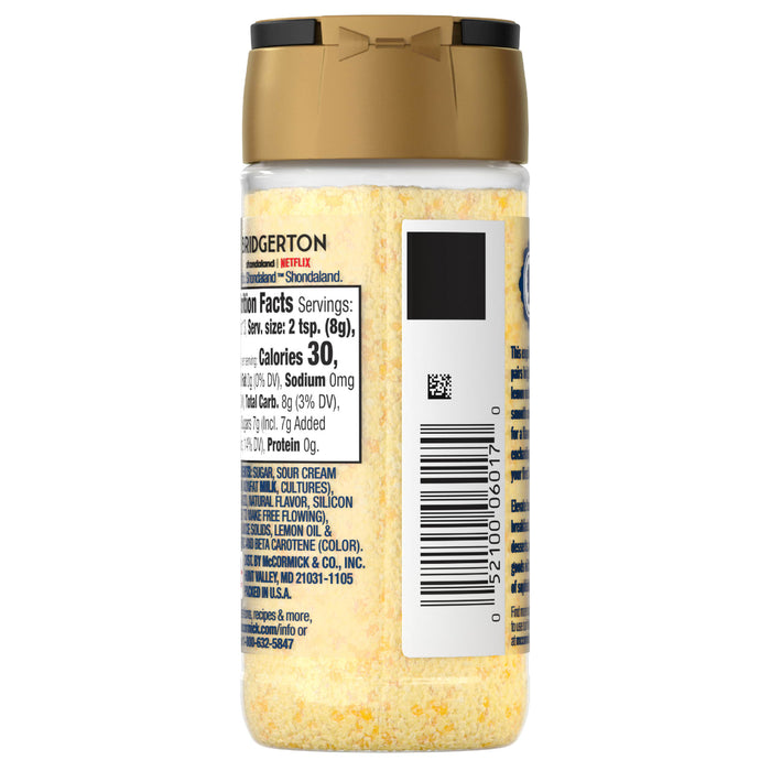 A bottle of Kraft grated parmesan cheese with nutrition information and a barcode on the label.