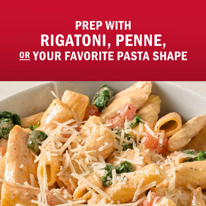 A bowl of pasta with rigatoni, penne, or your favorite pasta shape, topped with cheese.