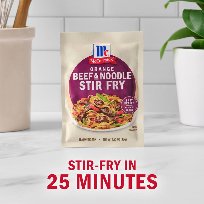 A packet of McCormick Orange Beef &amp; Noodle Stir Fry mix is displayed, promising a stir-fry meal in 25 minutes.