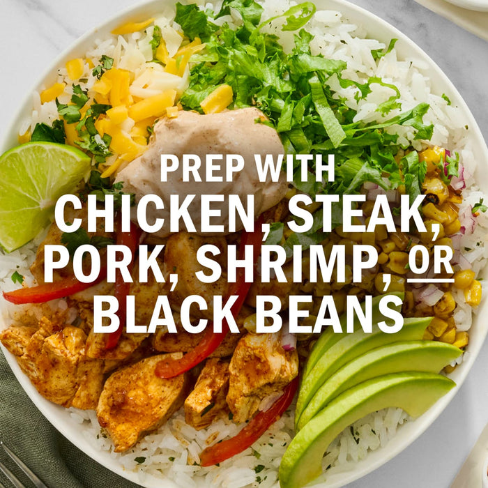 A vibrant bowl featuring rice, lettuce, corn, cheese, avocado, and a protein choice of chicken, steak, pork, shrimp, or black beans.