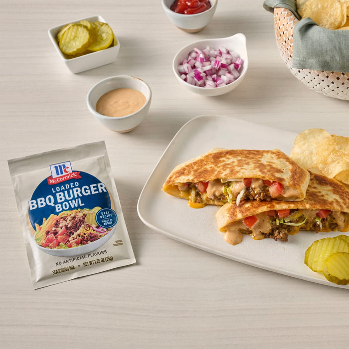 A package of Sam's Choice BBQ Burger Bowl mix is displayed next to a plate of prepared quesadillas, suggesting a recipe idea.