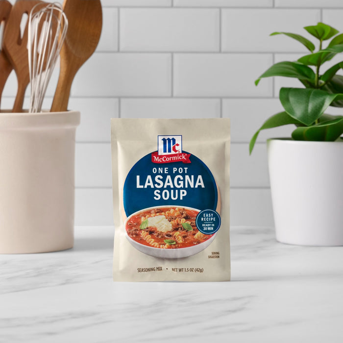 A packet of McCormick One Pot Lasagna Soup mix stands on a countertop.