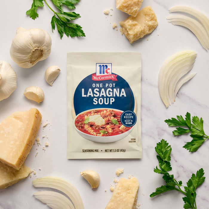 A packet of McCormick One-Pot Lasagna Soup mix is surrounded by ingredients like garlic, onion, parmesan cheese, and parsley.