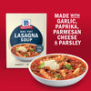 McCormick One Pot Lasagna Soup mix is shown with a prepared bowl of soup, highlighting the ingredients garlic, paprika, parmesan cheese and parsley.