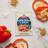 McCormick Sweet &amp; Smoky Pork Chops &amp; Apples seasoning mix is displayed with red bell peppers and spices.