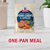 A packet of McCormick Sweet and Smoky Pork Chops &amp; Apples seasoning mix is displayed as a one-pan meal solution.
