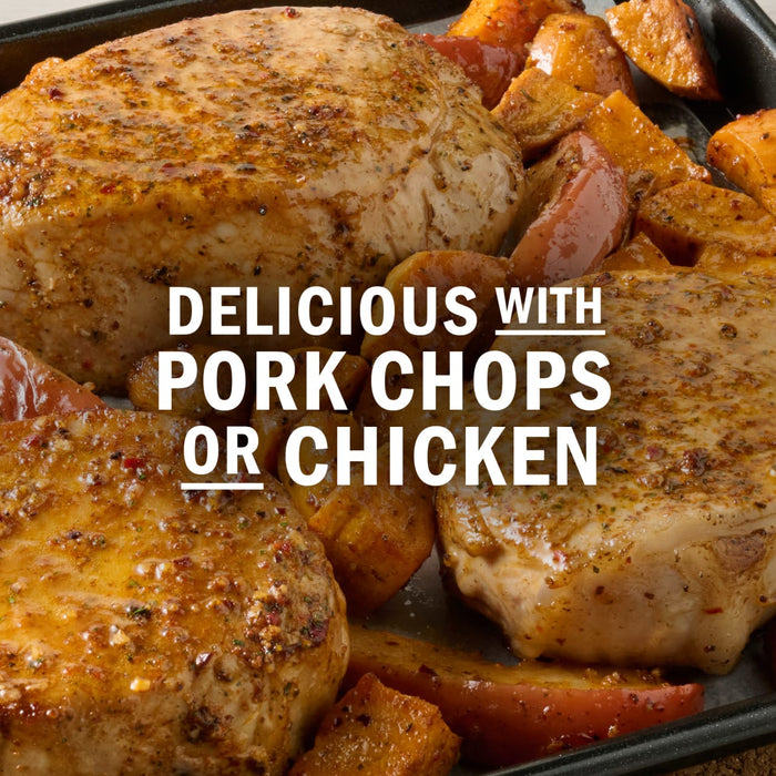 Pork chops and chicken are shown with a side of roasted sweet potatoes and apples.