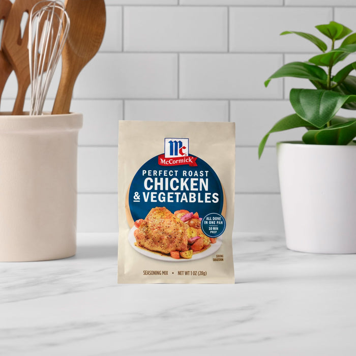 A packet of McCormick Perfect Pinch Chicken &amp; Vegetables seasoning mix is displayed on a countertop.