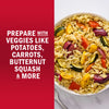 A bowl of pasta salad with colorful vegetables like potatoes, carrots, butternut squash, and more.