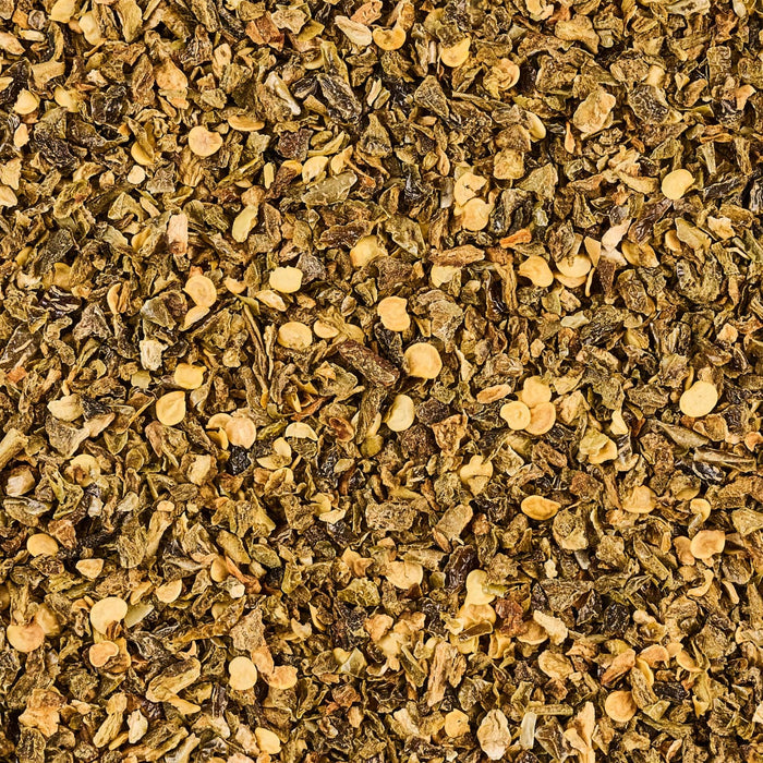 A close-up shows a pile of dried oregano, showcasing its texture and color.