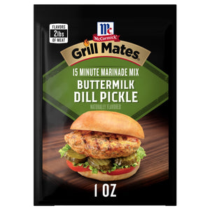 A 1.0 oz packet of Mccormick Grill Mates Buttermilk Dill Pickle Seasoning Mix featuring a grilled chicken sandwich with pickles and tomatoes on a wooden surface.