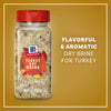 A clear bottle of Mccormick Turkey Dry Brine Rub, 12.2 Oz is displayed against a golden background, highlighting its flavorful and aromatic qualities for seasoning turkey.