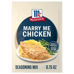 A packet of Mccormick Marry Me Chicken Seasoning Mix, 0.75 Oz, is shown in front of a plated serving suggestion of creamy chicken over mashed potatoes with asparagus.